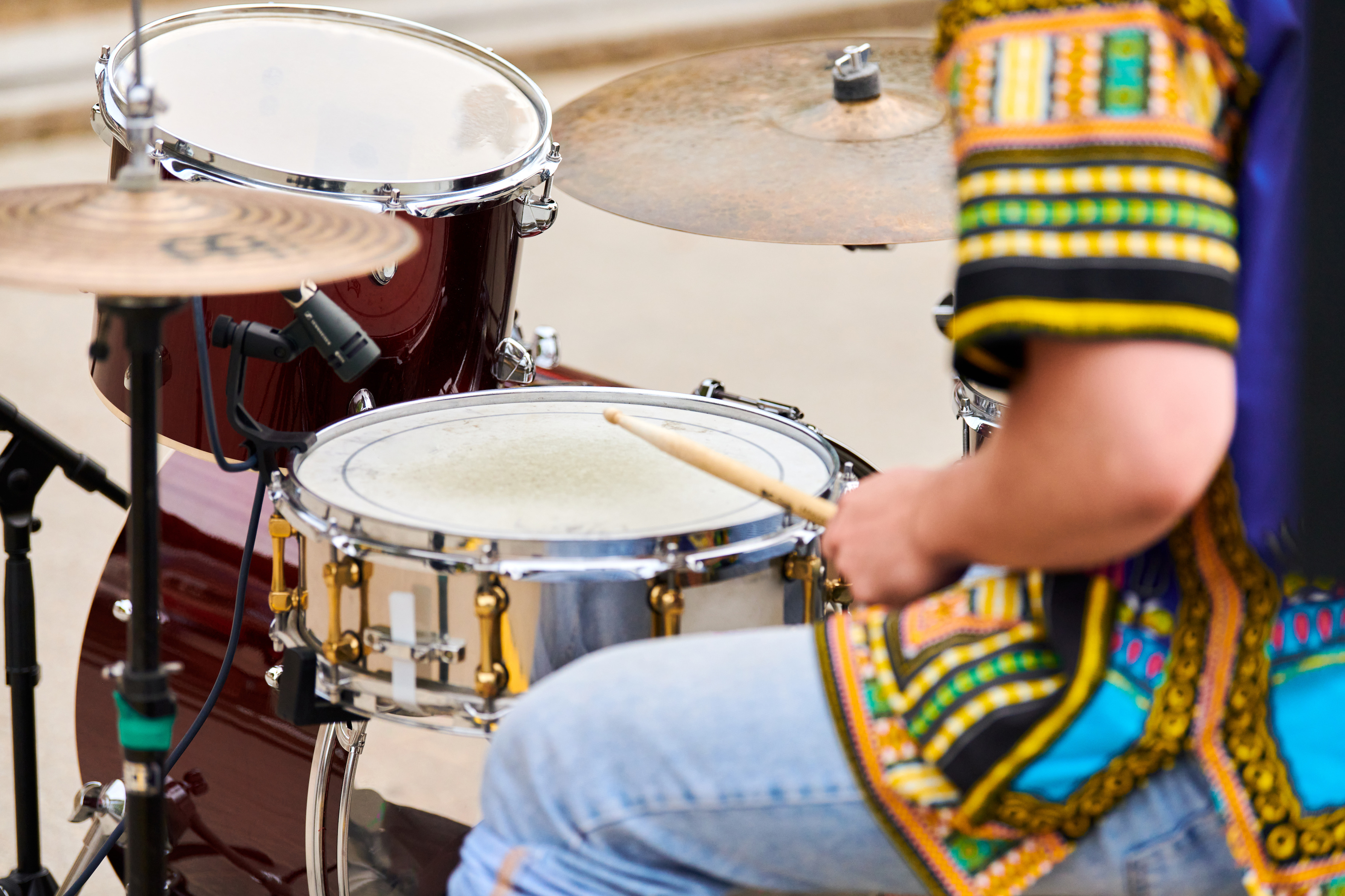 A young drummer performing on stage